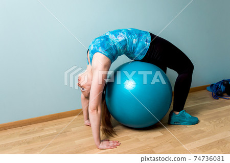 Self relaxation time at home on blue fitball 74736081