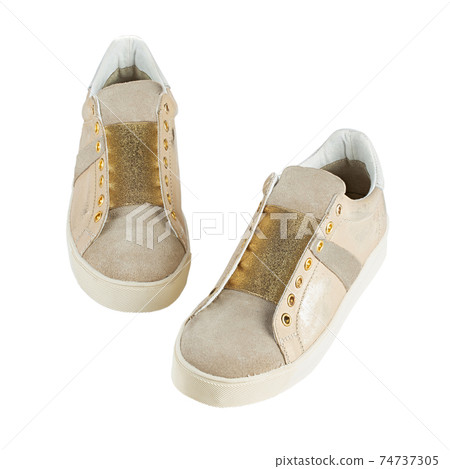 Stylish womens sneakers isolated white background. Stylish womens sneakers isolated white background. 74737305