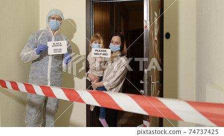 Medical worker visiting family of mother and daughter at home during coronavirus quarantine lockdown Medical worker visiting family of mother and daughter at home during coronavirus quarantine lockdown 74737425