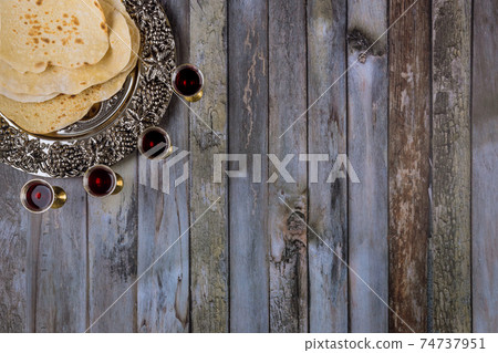 Matzoh passover holiday jewish celebration matzoh with on kiddush four cup of red kosher wine 74737951