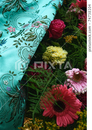 flowers and colored fabric for a holiday dress in valencia 74738104