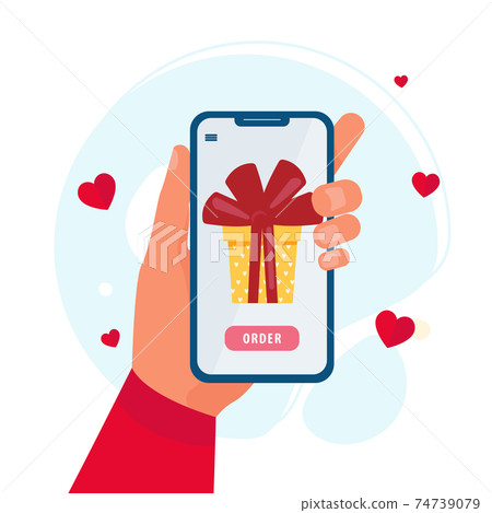 Smartphone in a hand with gift on screen. The concept of online shopping Smartphone in a hand with gift on screen. The concept of online shopping 74739079