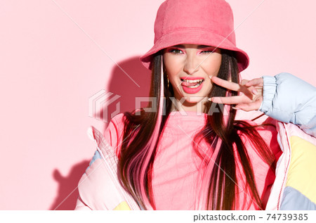 Funky cool fashion model girl posing with victory Funky cool fashion model girl posing with victory 74739385