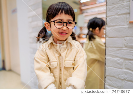 Girls wearing glasses 74740677
