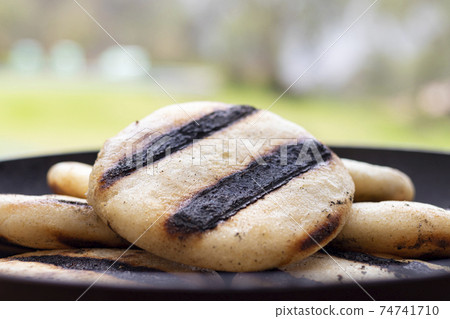 Colombian arepa on the grill - Traditional colombian food Stock