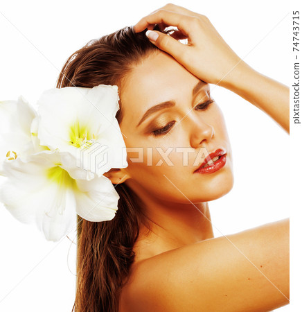 young pretty woman with Amarilis flower close up isolated on white 74743715