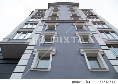 Building in perspective against the blue sky. Building in perspective against the blue sky. 74748745