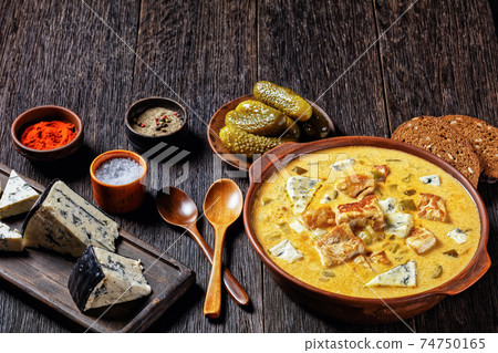 Pork stew with pickles, and blue mold cheese Pork stew with pickles, and blue mold cheese 74750165