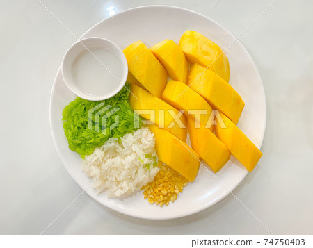 Thai mango with sticky rice and coconut milk 74750403