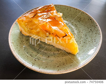 Beautiful cake with fruits placed on the table 74750406