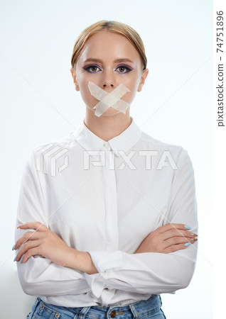 Young woman with closed mouth Young woman with closed mouth 74751896
