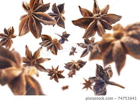 Anise stars levitate on a white background Anise stars levitate on a white background 74753841