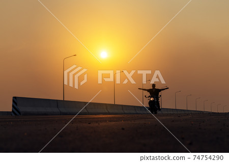 Young man riding big bike motocycle on asphalt high way against, Motorbike man has freedom 74754290