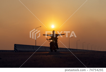 Young man riding big bike motocycle on asphalt high way against, Motorbike man has freedom 74754291