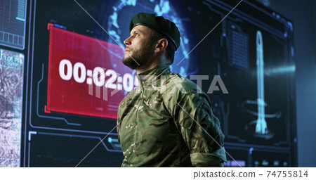 Male soldier against screen with count down 74755814