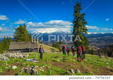 Climbers with equipment walking down from the mountain, Carpathians, Romania Climbers with equipment walking down from the mountain, Carpathians, Romania 74756305