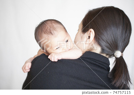 Mom letting her baby burp 74757115