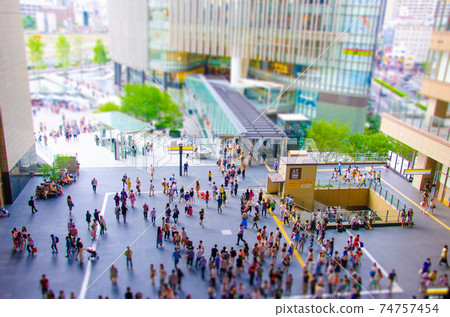 A miniature landscape of a concourse where people are constantly coming and going A miniature landscape of a concourse where people are constantly coming and going 74757454