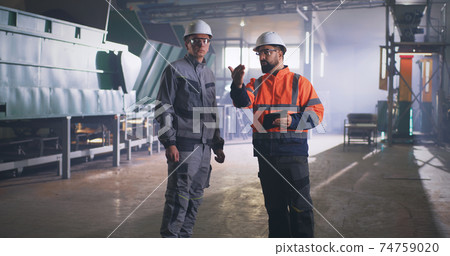 Engineer and supervisor during inspection in workshop Engineer and supervisor during inspection in workshop 74759020