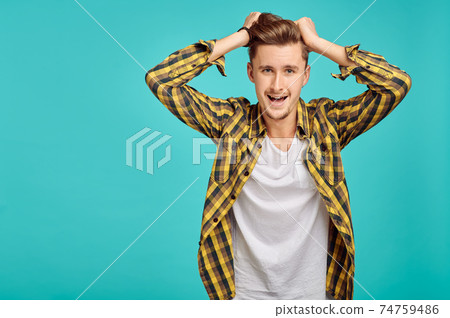 Cheerful man portrait, blue background, emotion Cheerful man portrait, blue background, emotion 74759486