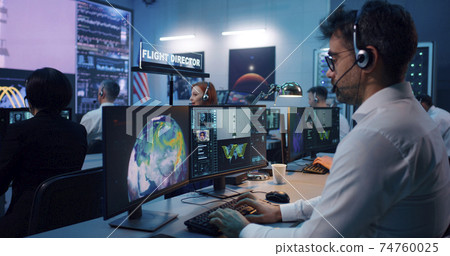 Flight director controlling rocket launch with team 74760025