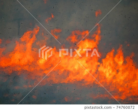 A flame burning in the open burning that heralds the arrival of spring A flame burning in the open burning that heralds the arrival of spring 74760872
