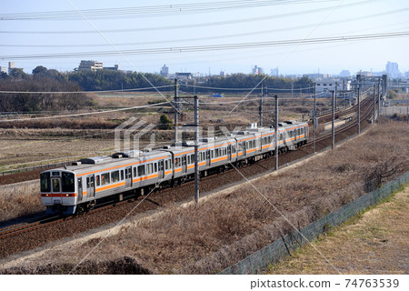 4 cars of 311 series ordinary train going on the Tokaido main line 74763539