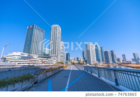 Yokohama cityscape of Japan View of Yokohama Bay Quarter shining in the blue sky from Minatomirai Bridge Yokohama cityscape of Japan View of Yokohama Bay Quarter shining in the blue sky from Minatomirai Bridge 74763663