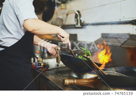 Stir fry cooking with chef Stir fry cooking with chef 74765139
