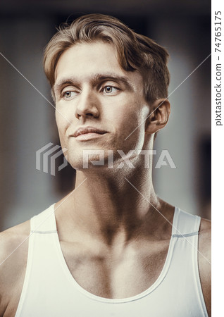 Fitness athletic man workout muscles exercise 74765175