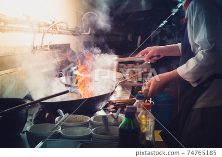 Chef stir fry cooking 74765185