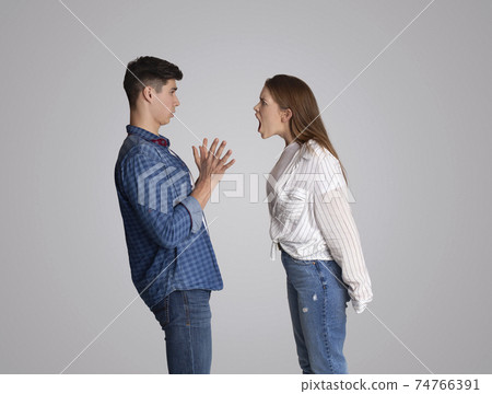 Stressed young married family couple arguing emotionally, blaming at husband 74766391