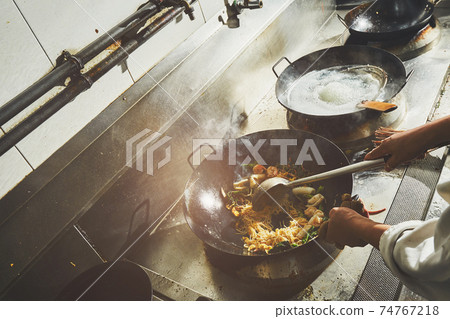 Chef stir fry cooking 74767218