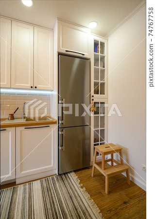 Cozy modern kitchen interior Cozy modern kitchen interior 74767758