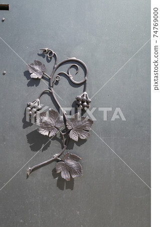 wrought-iron grille showing the vines in Eger, Hungary 74769000