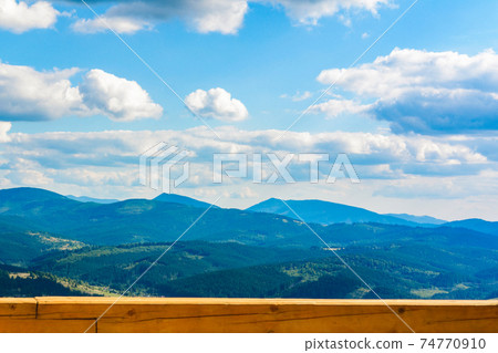 Beautiful view of the mountain range on the observation deck in the mountains of the Carpathians of Ukraine. Beautiful view of the mountain range on the observation deck in the mountains of the Carpathians of Ukraine. 74770910