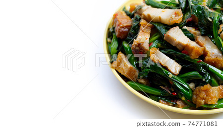 Stir fried chinese kale with crispy pork belly 74771081