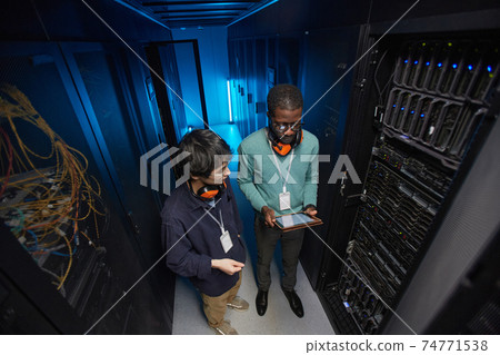 Two Network Engineers in Data Center 74771538