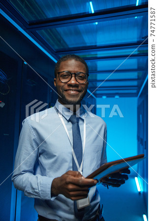 Smiling African American Man in Server Room 74771587