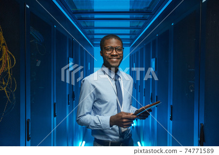 Smiling African American Man in Data Center Smiling African American Man in Data Center 74771589
