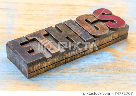ethics word abstract in wood type 74771767