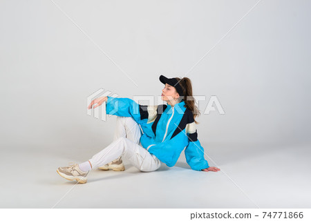 Young beautiful dancer posing on a studio background 74771866