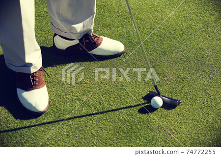 Close up photo of Man Putting Golf Ball Close up photo of Man Putting Golf Ball 74772255
