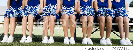 Cheerleading Squad Sitting on Bench Cheerleading Squad Sitting on Bench 74772332