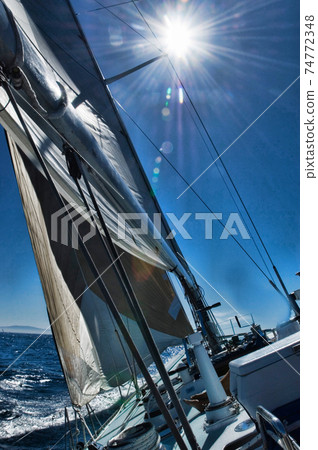 Photo of sailboat sailing in the ocean Photo of sailboat sailing in the ocean 74772348