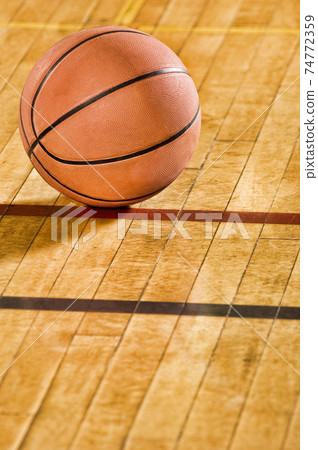 Close up shot of Basketball on court floor Close up shot of Basketball on court floor 74772359