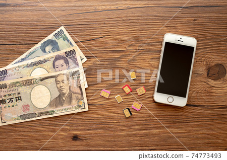移動電話合同_謹慎收費_木背景 移動電話合同_謹慎收費_木背景 74773493