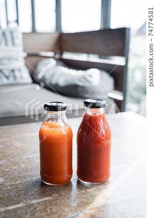 chili sauce and tomato ketchup on a bottle 74774581