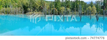 A panoramic view of the Shirogane Blue Pond in late autumn dyed in Biei Blue @ Hokkaido A panoramic view of the Shirogane Blue Pond in late autumn dyed in Biei Blue @ Hokkaido 74774778