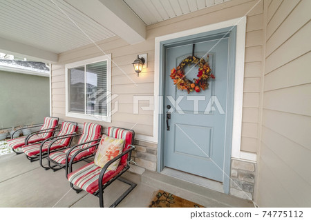 Colorful red outdoor chairs on a patio Colorful red outdoor chairs on a patio 74775112